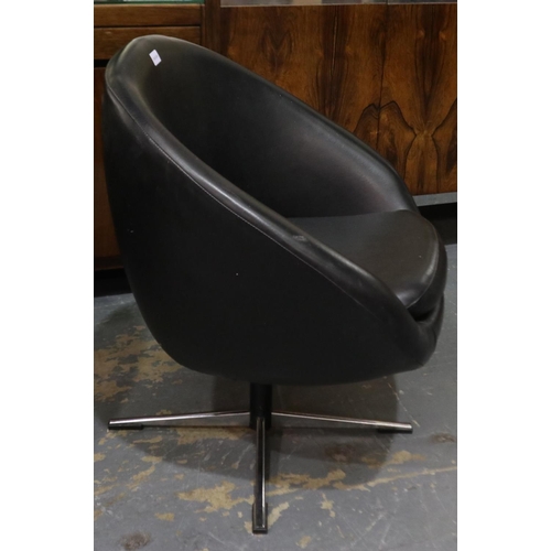 2098 - A pair of mid 20th century Overman Swedish polo club chairs in black vinyl on swivel bases, one chai... 