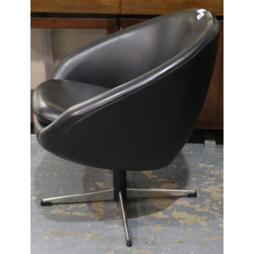 2098 - A pair of mid 20th century Overman Swedish polo club chairs in black vinyl on swivel bases, one chai... 