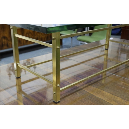 2100 - A 1960's brass framed rectangular centre table with heavy plate glass top, 119x61x39cm H. Not availa... 