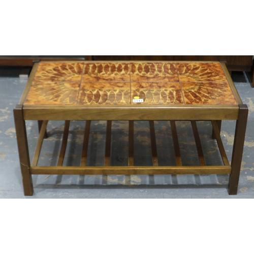 2111 - A mid 20th century Scandinavian centre table with tiled top and laddered under shelf, 88x47x40cm H. ... 