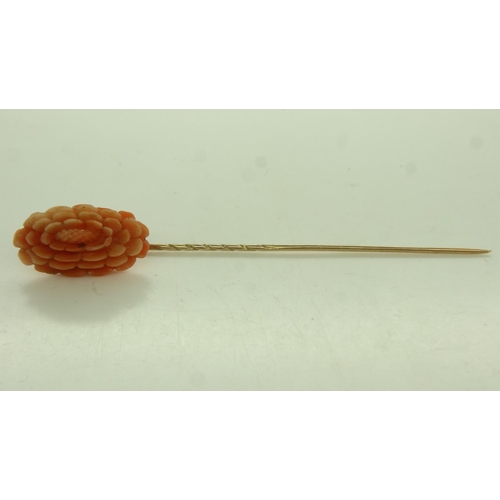 13 - 9ct gold stick pin, mounted with a large panel of carved coral, L: 70 mm, 2.8g. UK P&P Group 0 (£6+V... 