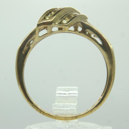 27 - 9ct gold diamond set crossover ring, size P, 2.8g. UK P&P Group 0 (£6+VAT for the first lot and £1+V... 