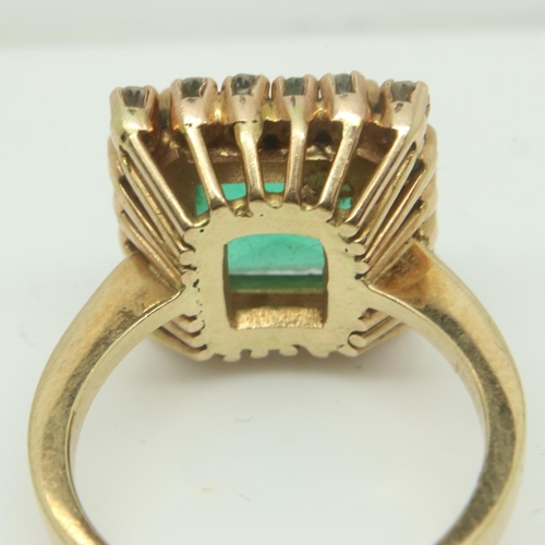 38 - A continental gold cocktail ring, set with a large princess-cut green stone surrounded by twenty dia... 