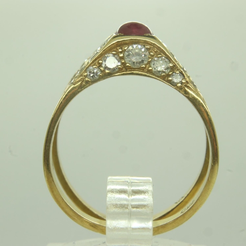 4 - A continental 18ct gold ring, pyramidal setting with a cabochon ruby and diamond-set shoulders, spli... 