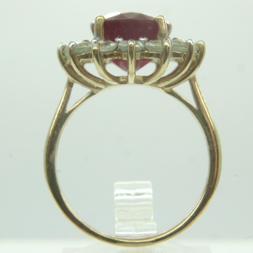 7 - 9ct gold ring, set with a large ruby and white stones, size Q, 5.9g. UK P&P Group 0 (£6+VAT for the ... 