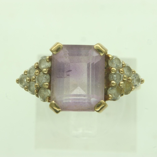 64 - 9ct gold amethyst set ring, with white stone set shoulders, size O/P, 3.1g. UK P&P Group 0 (£6+VAT f... 