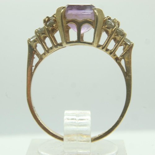 64 - 9ct gold amethyst set ring, with white stone set shoulders, size O/P, 3.1g. UK P&P Group 0 (£6+VAT f... 