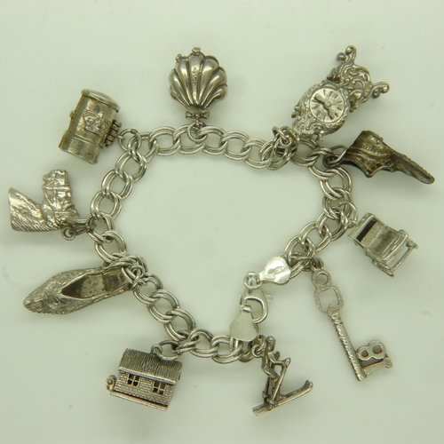 71 - 925 silver charm bracelet with ten charms, L: 20 cm. UK P&P Group 0 (£6+VAT for the first lot and £1... 