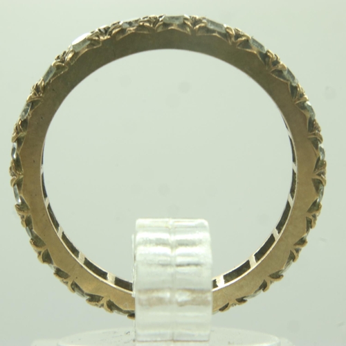 72 - 9ct gold stone set eternity ring, unmarked, size N, 2.2g. UK P&P Group 0 (£6+VAT for the first lot a... 