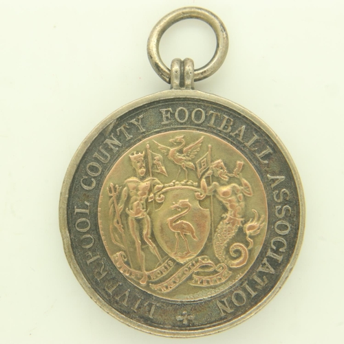 152 - LIVERPOOL COUNTY FOOTBALL ASSOCIATION: a hallmarked silver and gold washed Minor Winners 1925 fob. U... 