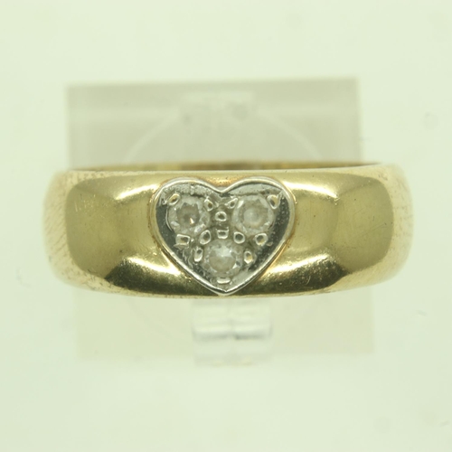 77 - 9ct gold wide profile band ring, set with a trilogy of diamonds in the form of a heart, size O/P, 4.... 