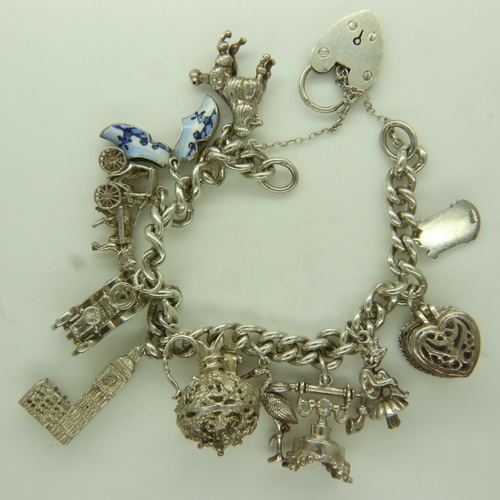 78 - Hallmarked silver charm bracelet with eleven charms, 63g. UK P&P Group 0 (£6+VAT for the first lot a... 