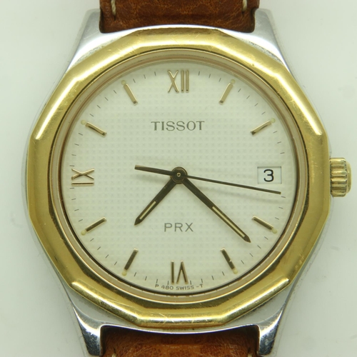 89 - TISSOT: A gents PRX steel cased wristwatch, with textured champagne coloured dial, requires battery.... 