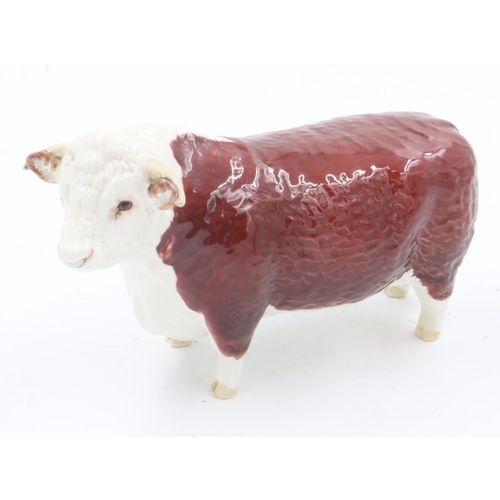 166 - Beswick Hereford bull, with damages, L: 21 cm. UK P&P Group 2 (£20+VAT for the first lot and £4+VAT ... 