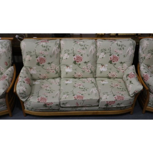 2117 - An Ercol Renaissance three piece lounge suite, Blonde elm frames model 1068 with upholstered cushion... 