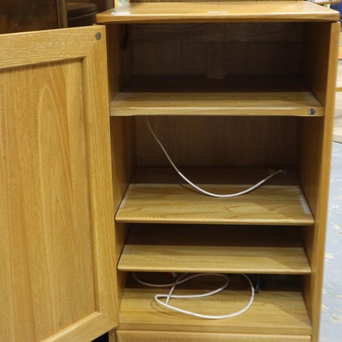 2118 - Ercol Blonde elm media cabinet, having a single door, shelved interior, hinged lid and single drawer... 