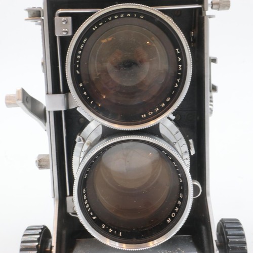 324A - Mamiya C33 professional camera with Mamiya Sekar 1:4.5 F=135mm lenses number 727948 and 702319, and ... 