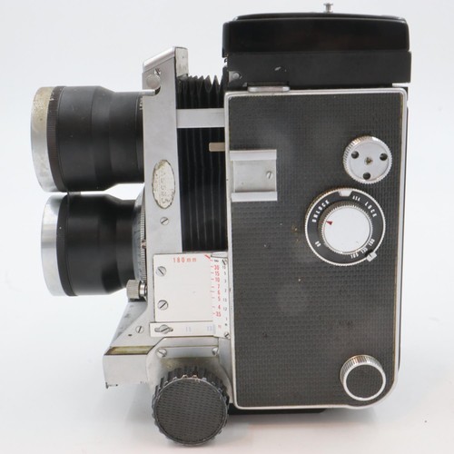 324A - Mamiya C33 professional camera with Mamiya Sekar 1:4.5 F=135mm lenses number 727948 and 702319, and ... 