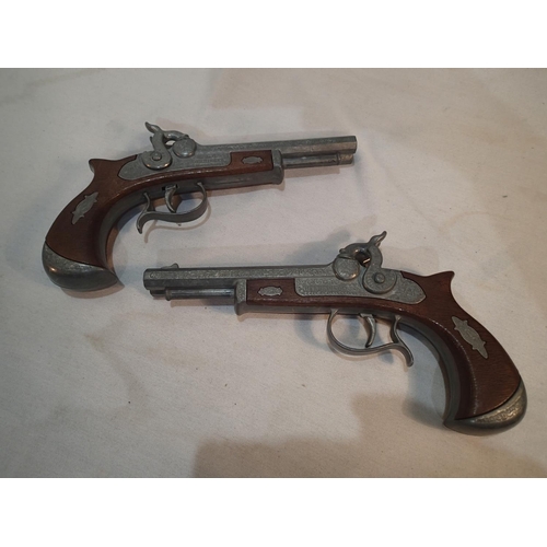 2110 - Pair of Derringer double barrel pistols by Ideal Model, cap firing with twin cocks, and double pull ... 