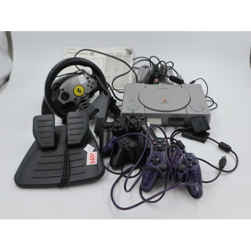 2524 - 1995/6 Sony PlayStation SCPH5552 with eleven games, plus PSU, four controllers and thrustmaster. Not... 