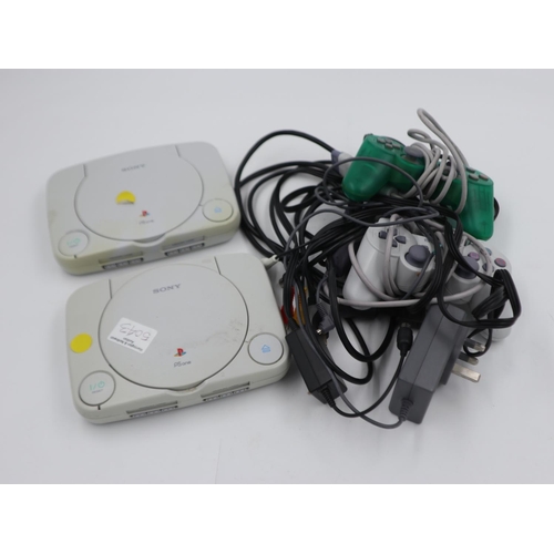 2536 - Two Sony PlayStation ones with two controller and plugs. Not available for in-house P&P