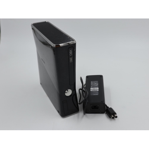 2537 - Xbox 360 with charger in grey case. Not available for in-house P&P