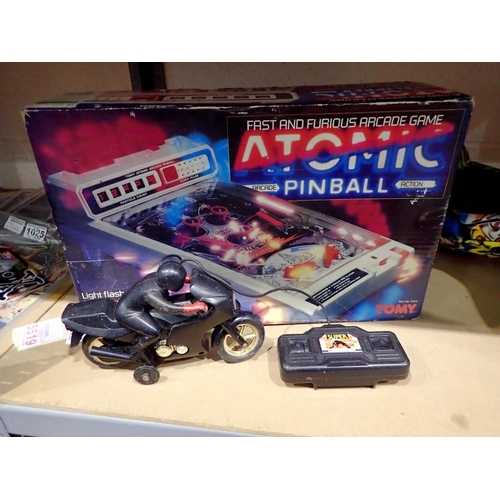 1020 - Tomy boxed atomic pinball #7054 and a remote control motorcycle. Not available for in-house P&P