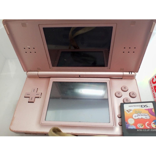 1113 - Nintendo DS Lite in pink, with junior classic games. UK P&P Group 1 (£16+VAT for the first lot and £... 