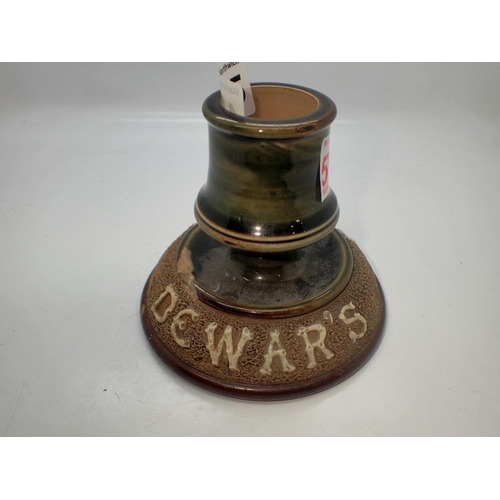 1335 - Royal Doulton stoneware advertising candlestick for Dewars whisky, chipped base. Not available for i... 