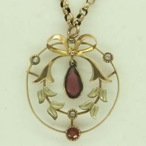 3 - 9ct gold garnet and seed pearl pendant on a 9ct gold chain, 4.9g. UK P&P Group 0 (£6+VAT for the fir... 