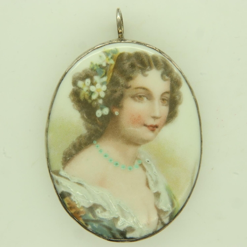 36 - A 19th century continental ceramic oval portrait, painted and enamelled, set into an oval pendant mo... 