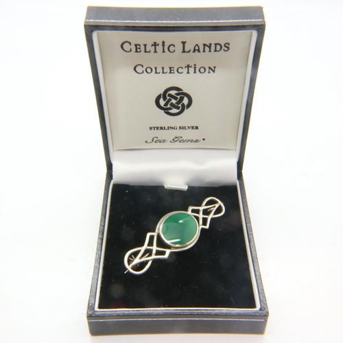 64 - Celtic Lands silver brooch set with an oval panel of jade, L: 60 mm, boxed. UK P&P Group 1 (£16+VAT ... 