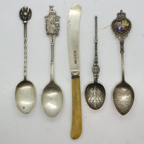 108 - Four commemorative hallmarked silver teaspoons, combined 48g, and a silver bladed butter knife (5). ... 