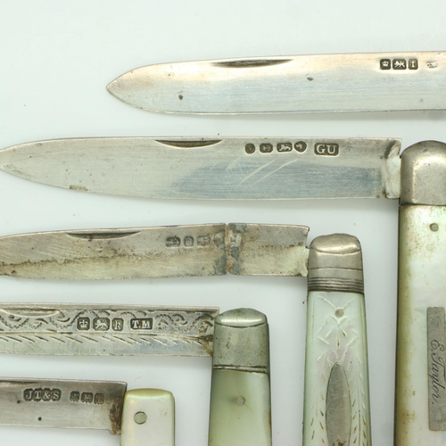 120 - Five folding fruit knives, each with hallmarked silver blade and mother of pearl grip, one with dama... 