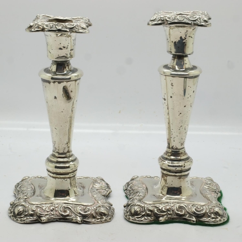 121 - Pair of hallmarked  silver candlesticks in the Regency manner, each H: 13 cm, Birmingham assay, weig... 