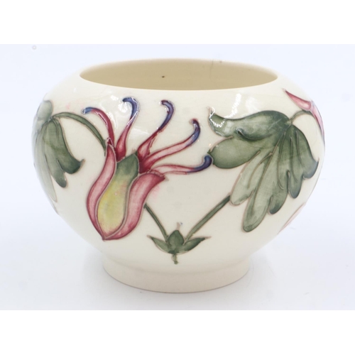 168 - Moorcroft footed bowl in the Columbine pattern, repaired crack from rim, H: 80 mm. UK P&P Group 1 (£... 