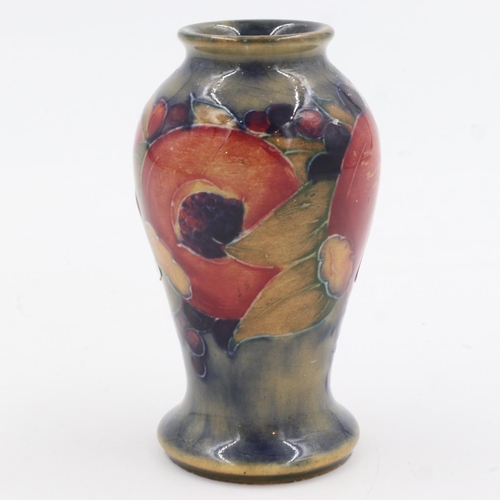 185 - Small Moorcroft vase in the Pomegranate pattern, signed to the base, no cracks or chips, H: 90 mm. U... 