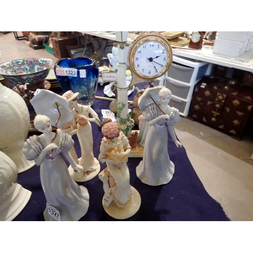 1327 - Four figurines and a figural clock. Not available for in-house P&P