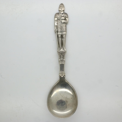 102 - Scandinavian 830 silver presentation spoon, the grip in the form of a Norseman holding a sword and o... 