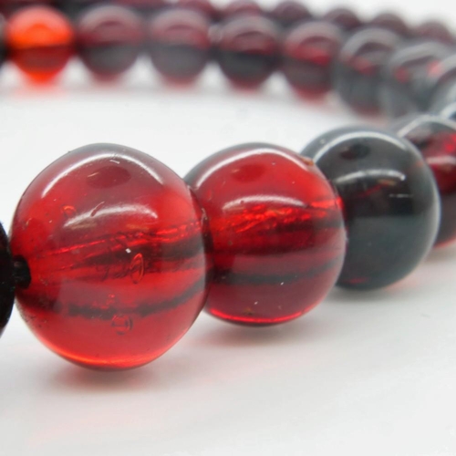 81 - A beaded necklace of graduating cherry amber, open L: 40 cm. UK P&P Group 0 (£6+VAT for the first lo... 