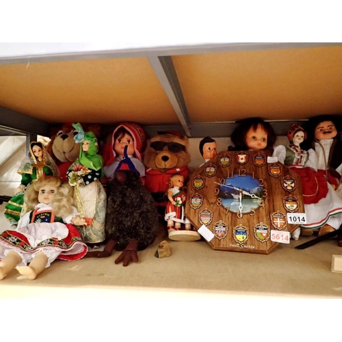 1014 - Shelf of ten dolls and bears, some with stands and a Banff, Canada clock. Not available for in-house... 