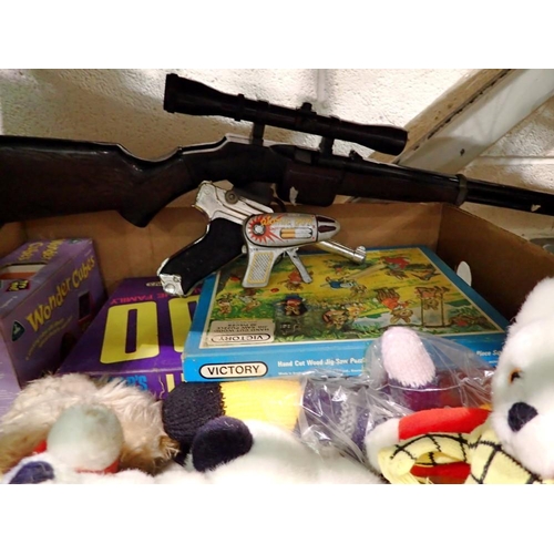 1017 - Box of vintage games and toys including Rupert and three toy guns. Not available for in-house P&P