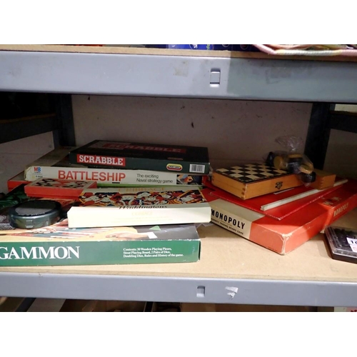 1050 - Shelf of board games, including Backgammon and Battleships. Not available for in-house P&P