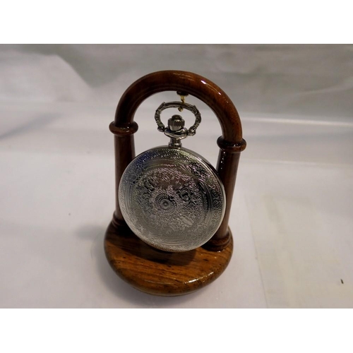 1079 - Pocket watch presented on wooden stand - working at lotting up. UK P&P Group 1 (£16+VAT for the firs... 