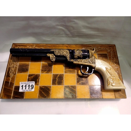 1119 - Replica pistol mounted on a chess board. UK P&P Group 2 (£20+VAT for the first lot and £4+VAT for su... 