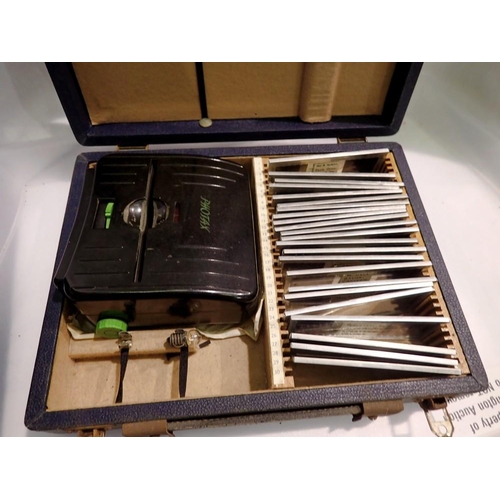 1150 - Photax slide viewer in box with slides. UK P&P Group 2 (£20+VAT for the first lot and £4+VAT for sub... 