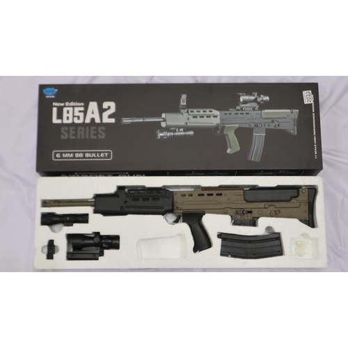 2033 - New spring powered 6mm BB rifle in black/green (L85 A1 style), boxed. UK P&P Group 3 (£30+VAT for th... 