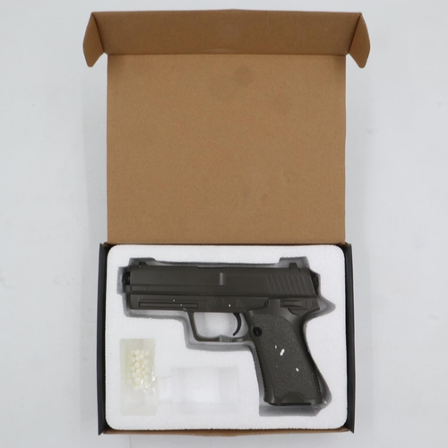 2040 - Airsoft pistol, model V23 in brown, boxed. P&P Group 2 (£18+VAT for the first lot and £3+VAT for sub... 