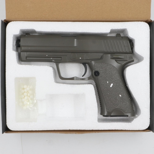 2040 - Airsoft pistol, model V23 in brown, boxed. P&P Group 2 (£18+VAT for the first lot and £3+VAT for sub... 