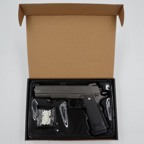 2042 - Airsoft pistol, model V19 in brown, boxed. P&P Group 2 (£18+VAT for the first lot and £3+VAT for sub... 